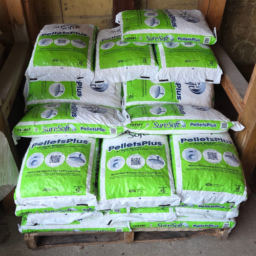 A stack of green and white bags labeled 